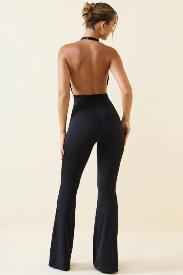 Halterneck Cut-Out Flared Jumpsuit in Black - Image 2