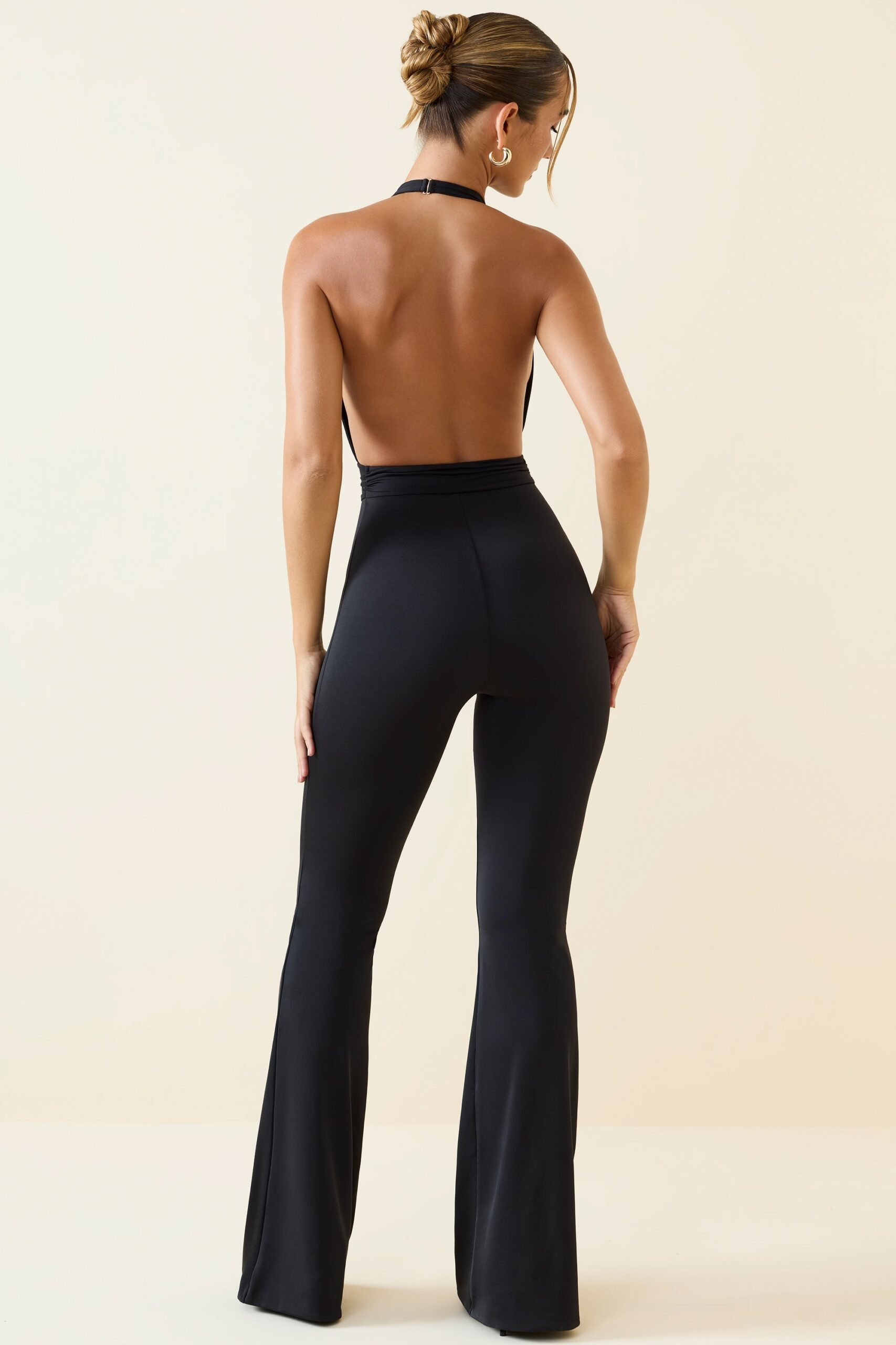 Halterneck Cut-Out Flared Jumpsuit in Black - Image 2