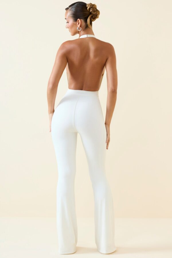 Halterneck Cut-Out Flared Jumpsuit in Vanilla - Image 2